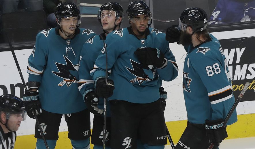 San Jose Sharks&#39; Evander Kane, second from right, celebrates with Radim Simek, from left, Dylan Gambrell and Brent Burns (88) after scoring a goal against the Toronto Maple Leafs during the third period of an NHL hockey game in San Jose, Calif., Tuesday, March 3, 2020. (AP Photo/Jeff Chiu)