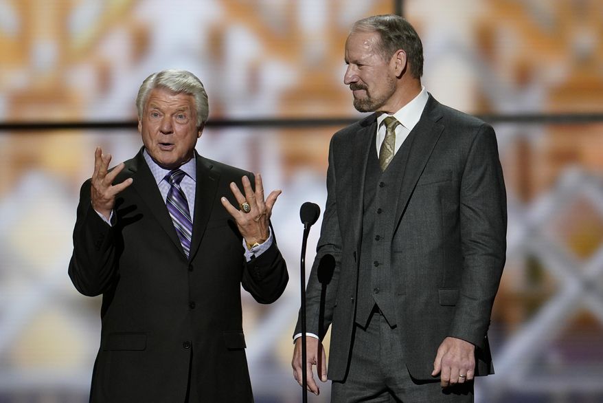 Former coaches, Jimmie Johnson, left, and Bill Cowher making introductions at the NFL Honors football award show Saturday, Feb. 1, 2020, in Miami. (AP Photo/David J. Phillip)