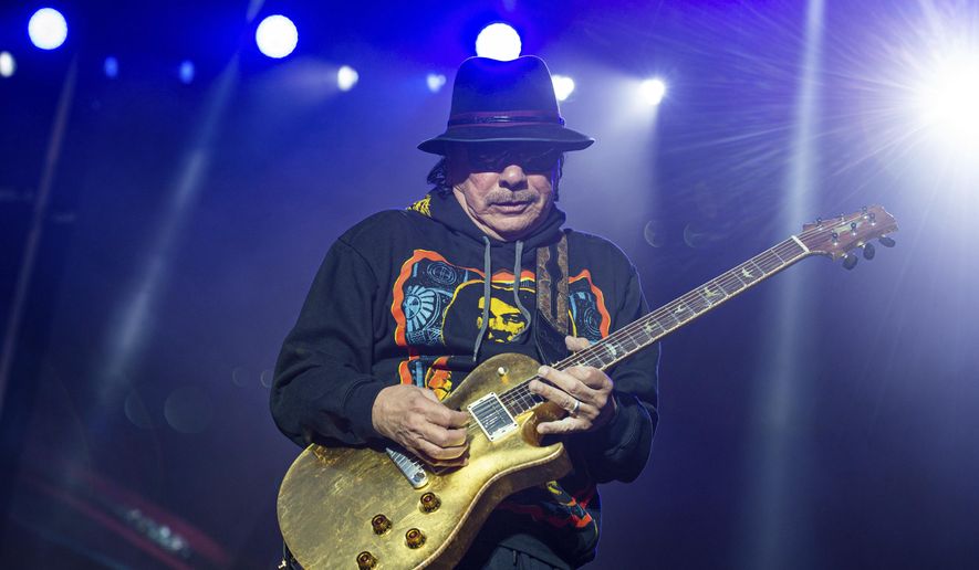 This May 26, 2019 file photo shows Carlos Santana of Santana performing at the BottleRock Napa Valley Music Festival in Napa, Calif. Santana announced Tuesday, March 10, 2020 that he has canceled the European tour dates of his Miraculous 2020 World Tour. Refunds will be available through point of purchase. He is the latest musician to cancel concerts because of public health concerns and performance restrictions due to the growing coronavirus outbreak. The vast majority of people recover from the new virus. According to the World Health Organization, people with mild illness recover in about two weeks, while those with more severe illness may take three to six weeks to recover. (Photo by Amy Harris/Invision/AP, File)