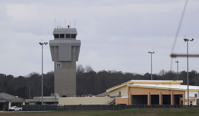 Dobbins Air Reserve Base is shown Monday, March 9, 2020, in Marietta, Ga. Thirty-four Georgians are among the U.S. citizens expected to arrive at the base on either Monday night or Tuesday morning, Georgia Gov. Brian Kemp said in a news release.(AP Photo/John Bazemore)