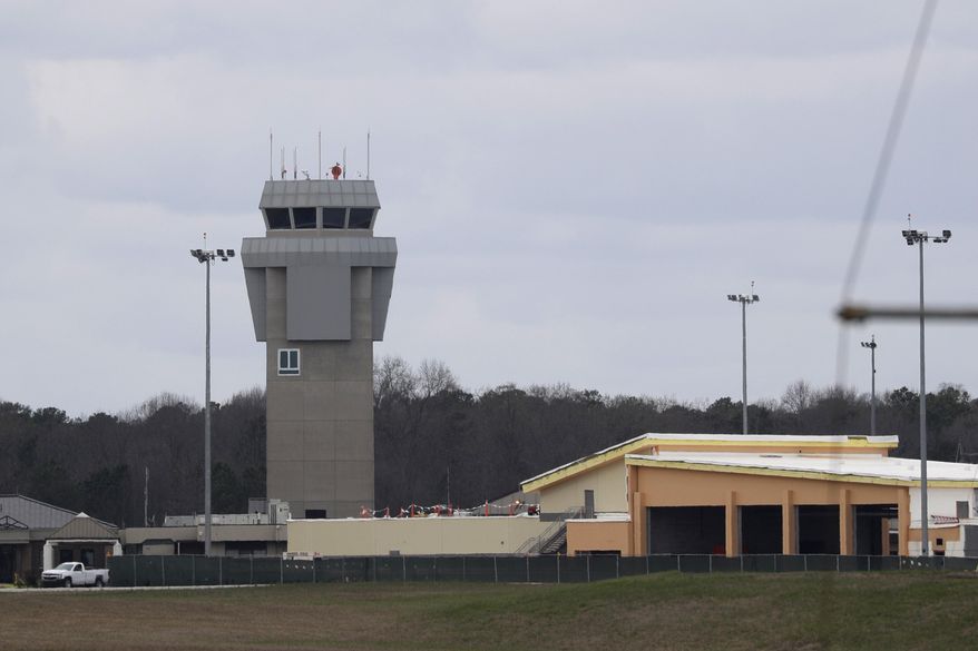 Dobbins Air Reserve Base is shown Monday, March 9, 2020, in Marietta, Ga. Thirty-four Georgians are among the U.S. citizens expected to arrive at the base on either Monday night or Tuesday morning, Georgia Gov. Brian Kemp said in a news release.(AP Photo/John Bazemore)