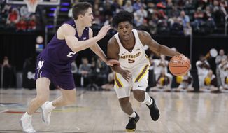 Minnesota&#39;s Marcus Carr (5) goes to the basket against Northwestern&#39;s Ryan Greer (2) during the first half of an NCAA college basketball game at the Big Ten Conference tournament, Wednesday, March 11, 2020, in Indianapolis. (AP Photo/Darron Cummings)