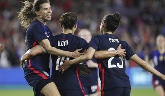 USA players celebrate after a Carli Lloyd goal during the She Believes Cup women&#39;s soccer game of USA vs. England at Exploria Stadium in Orlando on Thursday, March 5, 2020. (Stephen M. Dowell/Orlando Sentinel via AP)