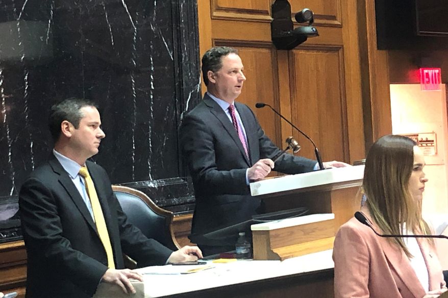 Indiana House Speaker Todd Huston speaks from the House podium during what is expected to be the final day of this year's legislative on Wednesday, March 11, 2020, at the Statehouse in Indianapolis. (AP Photo/Tom Davies)