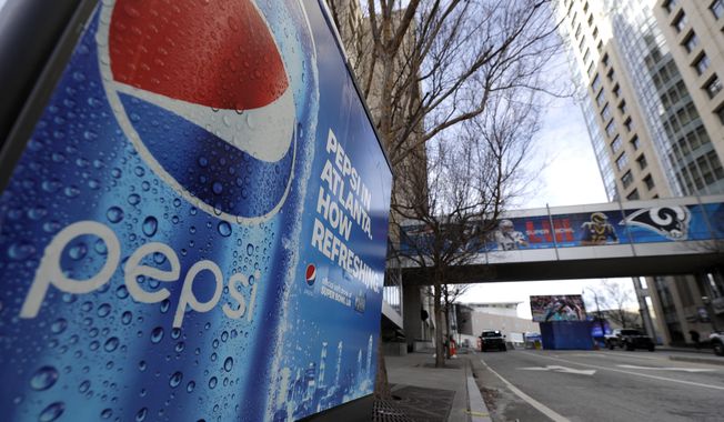 In this Jan. 30, 2019, file photo, an advertisement for Pepsi is shown downtown for the NFL Super Bowl 53 football game in Atlanta. PepsiCo says it&#x27;s buying energy drink maker Rockstar Energy Beverages for $3.85 billion. (AP Photo/David J. Phillip, File)