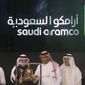 In this Dec. 11, 2019, file photo, Saudi Arabia&#39;s state-owned oil company Armco and stock market officials celebrate during the official ceremony marking the debut of Aramco&#39;s initial public offering (IPO) on the Riyadh&#39;s stock market, in Riyadh, Saudi Arabia. On April 2, 2020, President Trump said the Saudi government had assured him it was cutting back on oil production. News of the agreement gave a boost to oil prices and the stock market.  (AP Photo/Amr Nabil, File)  **FILE**