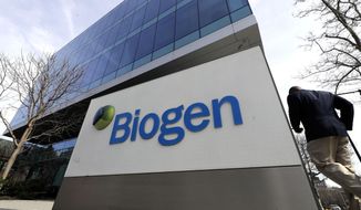 A man walks outside the Biogen Inc., headquarters, Wednesday, March 11, 2020, in Cambridge, Mass. Seventy of Massachusetts&#39; 92 confirmed coronavirus cases have been linked to a meeting of Biogen executives that was held at the Marriott Long Wharf hotel in Boston in late February 2020. For most people, the virus causes only mild or moderate symptoms, such as fever and cough. For some, especially older adults and people with existing health problems, it can cause more severe illness, including pneumonia. The vast majority of people recover from the new virus. (AP Photo/Steven Senne)