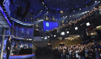 This Feb. 4, 2020 image released by CBS shows host Stephen Colbert, left, greeting the audience during a taping of &amp;quot;The Late Show with Stephen Colbert&amp;quot; in New York. The show, along with other New York-based late night talk shows &amp;quot;The Tonight Show Starring Jimmy Fallon&amp;quot; and &amp;quot;The Daily Show with Trevor Noah&amp;quot; will tape their shows without studio audiences due to the new coronavirus. For most people, the new coronavirus causes only mild or moderate symptoms. For some it can cause more severe illness.  (Scott Kowalchyk/CBS via AP)