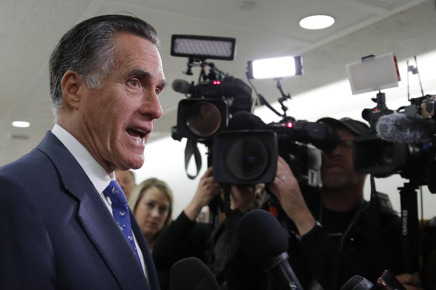 Sen. Mitt Romney, R-Utah, speaks to media as he arrives for a briefing on Capitol Hill in Washington, Thursday, March, 12, 2020, on the coronavirus outbreak. (AP Photo/Carolyn Kaster) **FILE**