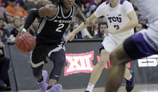 Kansas State guard Cartier Diarra (2) drives past TCU guard Francisco Farabello (3) during the first half of an NCAA college basketball game in the first round of the Big 12 men&#x27;s basketball tournament in Kansas City, Mo., Wednesday, March 11, 2020. (AP Photo/Orlin Wagner)