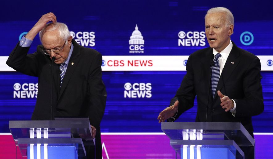 From left, Democratic presidential candidates Sen. Bernie Sanders, I-Vt., and former Vice President Joe Biden, participate in a Democratic presidential primary debate at the Gaillard Center, Tuesday, Feb. 25, 2020, in Charleston, S.C., co-hosted by CBS News and the Congressional Black Caucus Institute. (AP Photo/Patrick Semansky)