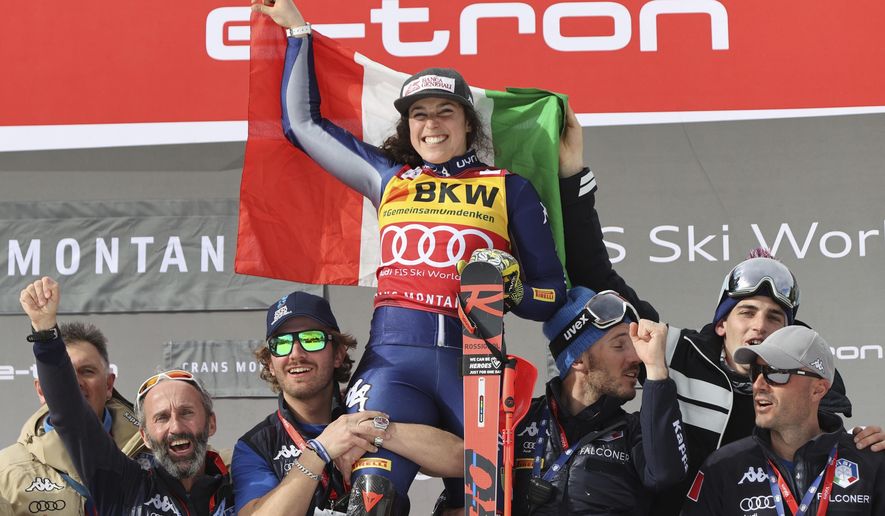 Italy's Federica Brignone celebrates winning an alpine ski, women's World Cup alpine combined, in Crans Montana, Switzerland, Sunday, Feb. 23, 2020. (AP Photo/Alessandro Trovati)