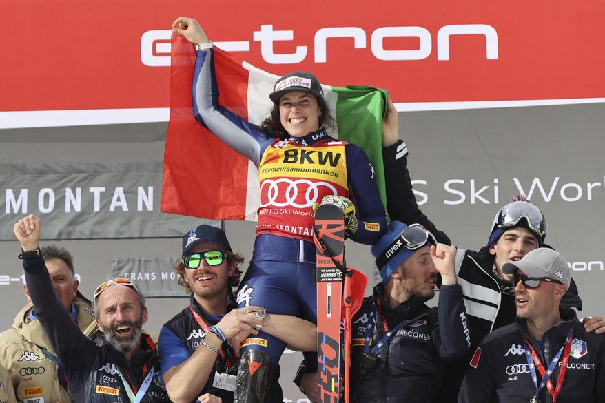 Italy's Federica Brignone celebrates winning an alpine ski, women's World Cup alpine combined, in Crans Montana, Switzerland, Sunday, Feb. 23, 2020. (AP Photo/Alessandro Trovati)