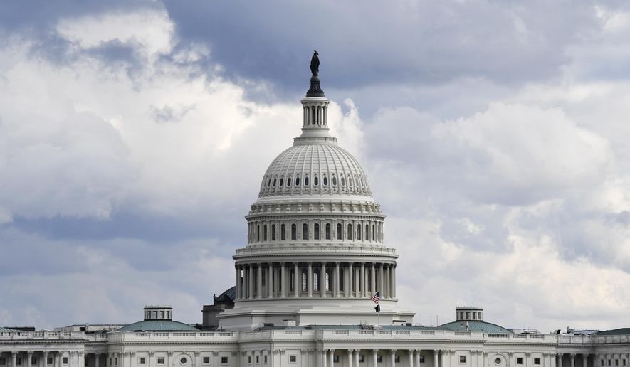 FILE - This Dec. 31, 2019, file photo shows a view of the U.S. Capitol Building in Washington. Congress is shutting the Capitol and all House and Senate office buildings to the public until April in reaction to the spread of the coronavirus. (AP Photo/Susan Walsh, File)