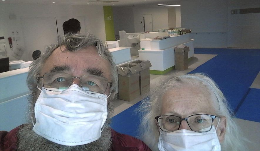 This Feb. 24, 2020 photo provided by Greg and Rose Yerex shows them in a hospital in Nagoya, Japan. Former passengers of the cruise ship Diamond Princess, they both tested positive for the coronavirus. Rose has since tested negative for the virus but decided to stay with Greg until he is cleared to leave. The couple said they're happy to have each other, but that living in isolation has been difficult. "I just want to go home and be normal," Greg said. (Greg Yerex via AP)
