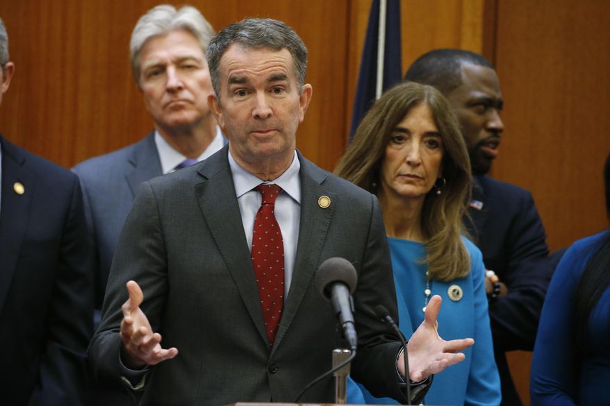 Virginia Gov. Ralph Northam, front, gestures during a news conference as House speaker Eileen Filler-Corn, right, and Secretary of Public safety Brian Moran, left, look on at the Capitol Thursday March 12 , 2020, in Richmond, Va. Northam declared a state of emergency due to the coronavirus outbreak. (AP Photo/Steve Helber)