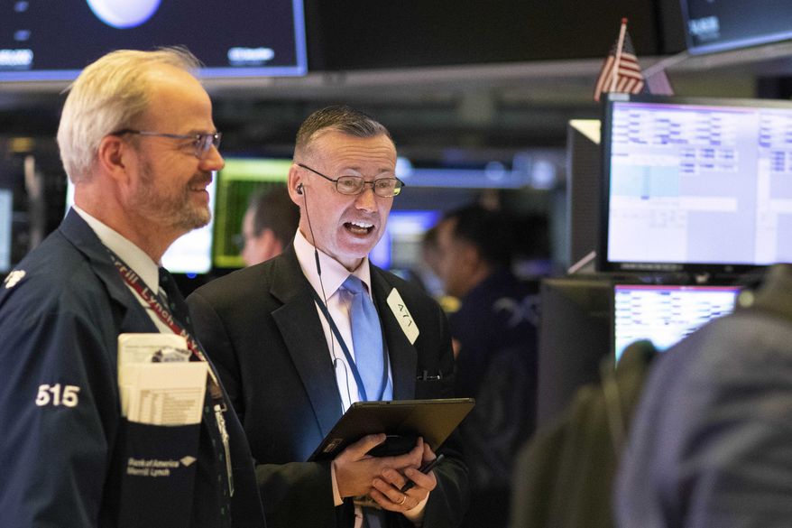Traders work at the New York Stock Exchange, Friday, March 13, 2020. Stocks are opening sharply higher on Wall Street a day after the worst drop since 1987.(AP Photo/Mark Lennihan)