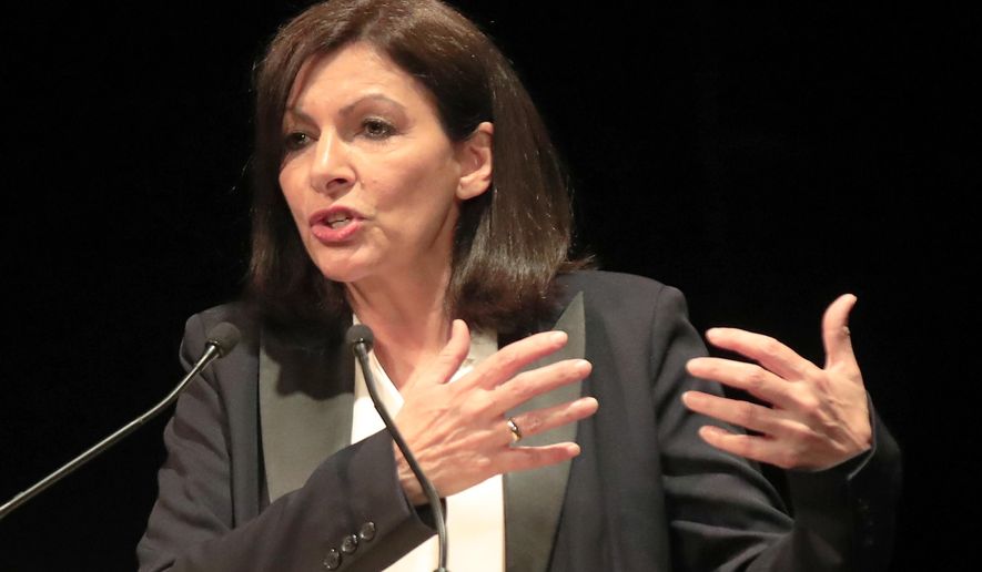 Paris mayor Anne Hidalgo gestures as she speaks during a meeting for the upcoming mayoral elections in Paris Monday, March 2, 2020. France local elections starting March 15, 2020. (AP Photo/Michel Euler)