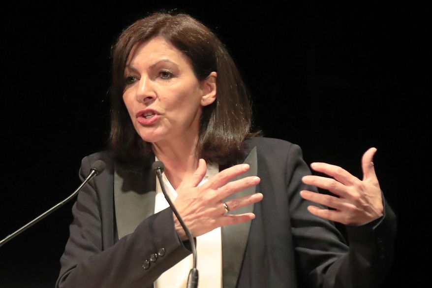 Paris mayor Anne Hidalgo gestures as she speaks during a meeting for the upcoming mayoral elections in Paris Monday, March 2, 2020. France local elections starting March 15, 2020. (AP Photo/Michel Euler)