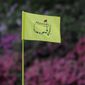 In this April 11, 2019, file photo, the flag on the 13th hole blows in the wind during the first round for the Masters golf tournament in Augusta, Ga. Augusta National decided Friday, March 13, 2020, to postpone the Masters because of the spread of the coronavirus. Club chairman Fred Ridley says he hopes postponing the event puts Augusta National in the best position to host the Masters and its other two events at some later date. Ridley did not say when it would be held.(AP Photo/David J. Phillip, Fil) **FILE**