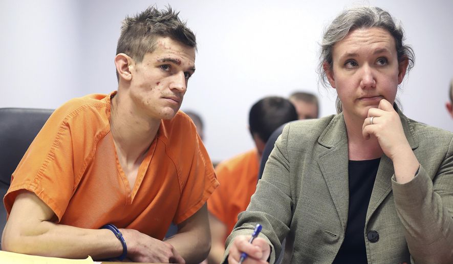 In this photo taken Thursday, March 12, 2020, Logan Dallas Christopher, 25, of Stevensville, Mont. is formally charged with killing the mother of his two young children and his own mother at a hearing in Ravalli County Justice Court in Hamilton, Mont. His bail was set at $2 million and he did not enter a plea. Christopher was represented by public defender Sarah Busch, who asked that his bail be set at $100,000. (Perry Backus/Ravalli Republic via AP)