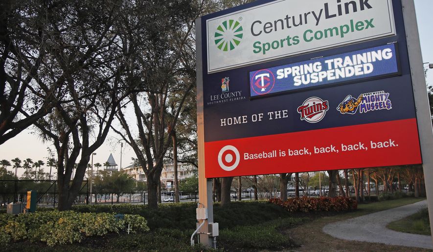 A sign outside Hammond Stadium reads "spring training suspended" after a baseball game was cancelled between the Minnesota Twins and the Baltimore Orioles, Thursday, March 12, 2020, in Fort Myers, Fla. Major League Baseball has suspended the rest of its spring training game schedule because if the coronavirus outbreak. MLB is also delaying the start of its regular season by at least two weeks. (AP Photo/Elise Amendola)