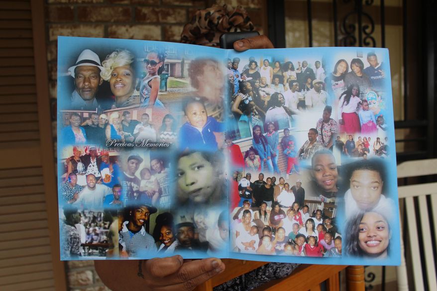 In this April 12, 2020 photo.Teresa Brown holds a pamphlet in Greenwood, Miss. that was distributed during the funeral for Walter Stewart Jr. The pamphlet featured a collage of images show Stewart with friends and family. Stewart's slain body was discovered in Sidon Cutoff Lake by a fisherman on April 12, 2019. (Gerard Edic/The Commonwealth via AP)