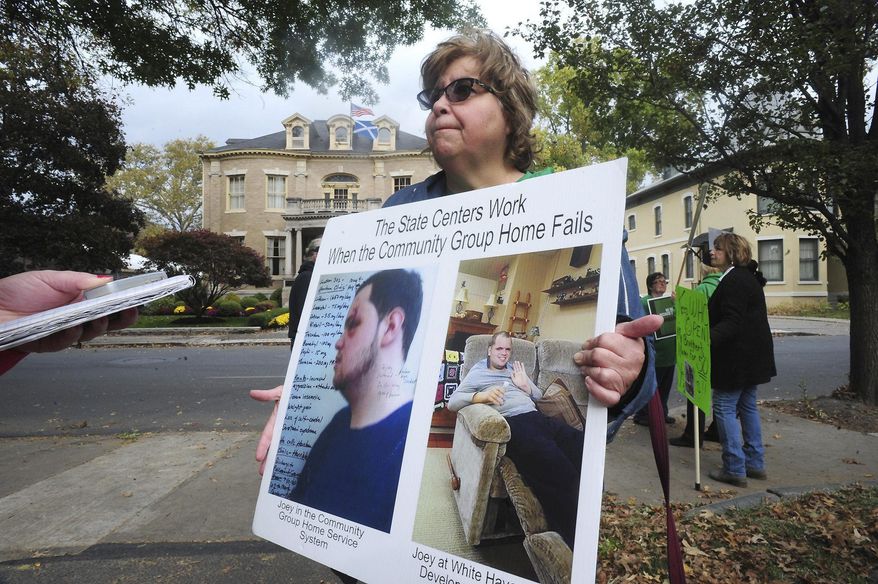 Susan Jennings, whose son Joey is a resident of the White Haven Center, joins others protesting the proposed closing of the White Haven Center Wednesday, March 11, 2020 at the Westmoreland Club, in Wilkes-Barre, Pa. (Mark Moran/The Citizens' Voice via AP)