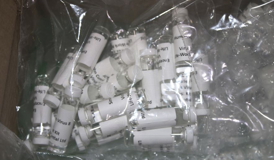 In this Thursday, March 12, 2020, photo released by the U.S. Customs and Border Protection (CBP), shows a package containing suspected counterfeit COVID-19 test kits arriving from the United Kingdom. CBP officers discovered six plastic bags containing various vials, while conducting an enforcement examination of a parcel manifested as &amp;quot;Purified Water Vials&amp;quot; with a declared value of $196.81. A complete examination of the shipment, led to the finding of vials filled with a white liquid and labeled &amp;quot;Corona Virus 2019nconv (COVID-19)&amp;quot; and &amp;quot;Virus1 Test Kit&amp;quot;. The shipment was turned over to the U.S. Food and Drug Administration (FDA) for analysis. (U.S. Customs and Border Protection via AP)