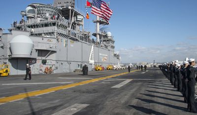 191127-N-FG333-1144  SAN DIEGO (Nov. 27, 2019) Sailors man the rails of the amphibious assault ship USS Boxer (LHD 4). Boxer, part of the Boxer Amphibious Ready Group (ARG), is returning to its homeport of San Diego following a 7-month deployment to the 5th and 7th fleet area of operations. (U.S. Navy photo by Mass Communication Specialist 2nd Class David Ortiz)
