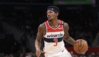 Washington Wizards guard Bradley Beal (3) dribbles the ball during the second half of an NBA basketball game against the Miami Heat, Sunday, March 8, 2020, in Washington. The Heat won 100-89. (AP Photo/Nick Wass) ** FILE **