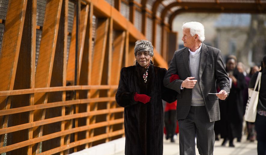 Greenville County councilwoman Xanthene Norris, left, walks across the Hampton Avenue Bridge for the first time with county administrator Joe Kernell during a dedication event Friday, March 6, 2020. (Josh Morgan/The Independent-Mail via AP)