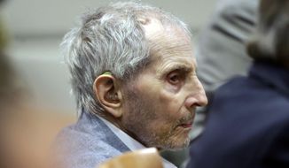FILE - In this Tuesday, March 10, 2020, file photo, real estate heir Robert Durst listens to his defense attorney give their opening statement during his murder trial in Los Angeles. Durst&#39;s trail has been delayed for three weeks over fears of the transmission of coronavirus and will stand adjourned until April 6. (AP Photo/Alex Gallardo, Pool, File)