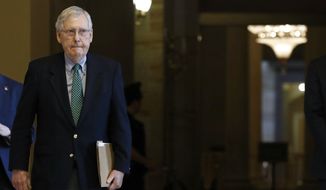Senate Majority Leader Mitch McConnell of Ky. walks to the Senate Chamber on Capitol Hill in Washington, Monday, March 16, 2020. (AP Photo/Patrick Semansky)