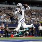 In this Sept. 22, 2019, file photo, Dallas Cowboys quarterback Dak Prescott (4) gets past Miami Dolphins defensive back Walt Aikens (35) and into the end zone for a touchdown in the second half of an NFL football game in Arlington, Texas. (AP Photo/Ron Jenkins, File)