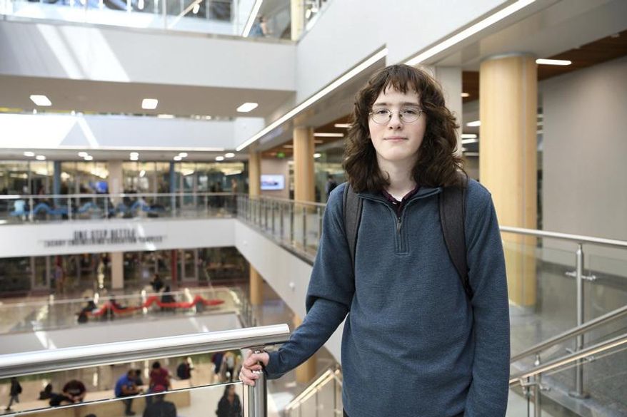Eric Comstock, 14, a sophomore at Texas A&M University, stands Thursday, March 5, 2020, inside the Zachry Engineering Education Complex in College Station, Texas. Eric is an aerospace engineering major with minors in chemistry and mathematics and recently was accepted into the engineering honors program. He completed his math minor through dual credit before he became a full-time student last semester. Originally, he was a chemistry major, but while he excelled in his coursework, he decided he was “slightly more passionate about aerospace." (Laura McKenzie/College Station Eagle via AP)