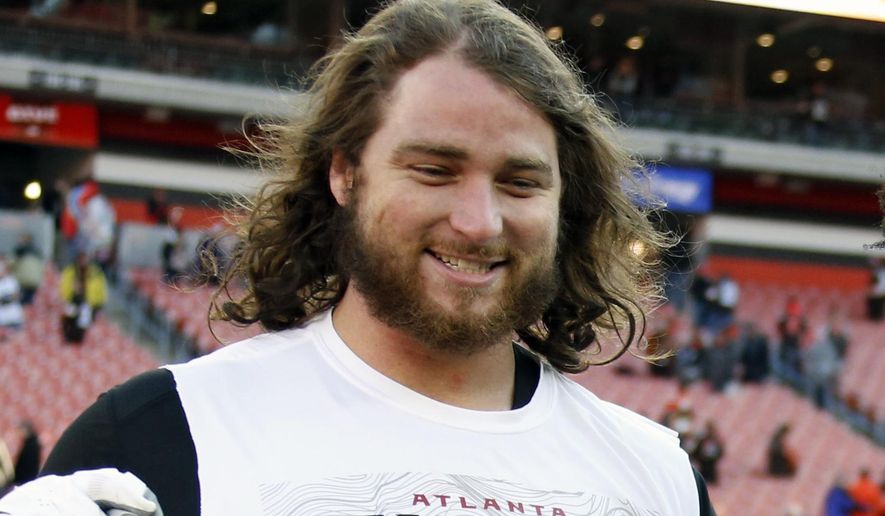 FILE - In this Nov. 11, 2018, file photo, Atlanta Falcons offensive tackle Ty Sambrailo is shown after an NFL football game in Cleveland. The Atlanta Falcons are releasing running back Devonta Freeman and three more veterans to clear salary cap room. The Falcons also will release cornerback Desmond Trufant and have announced they have cut offensive tackle Ty Sambrailo and tight end Luke Stocker. Freeman and Trufant are former Pro Bowl players who had been considered foundation players for the franchise.(AP Photo/Ron Schwane, File)