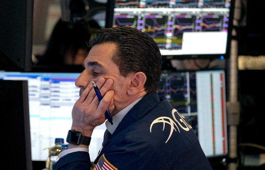 Trader Peter Mazza works on the floor of the New York Stock Exchange Monday, March 16, 2020. (AP Photo/Craig Ruttle)