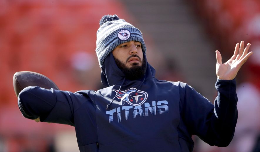 FILE - In this Jan. 19, 2020, file photo, Tennessee Titans' quarterback Marcus Mariota warms up before the NFL AFC Championship football game against the Kansas City Chiefs in Kansas City, Mo. The Las Vegas Raiders have agreed on a contract with free agent Mariota to provide an experienced backup behind starter Derek Carr. A person familiar with the deal said Monday, March 16, 2020, the Raiders reached the deal with the former No. 2 overall pick in the 2015 draft. (AP Photo/Charlie Riedel, File)