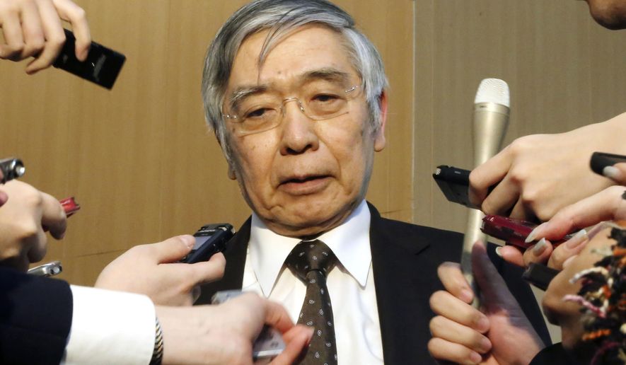 In this March 12, 2020, photo, Bank of Japan Gov. Haruhiko Kuroda speaks to reporters after the talks with Japanese Prime Minister Shinzo Abe at the prime minister&#39;s official residence in Tokyo. The Bank of Japan has convened an emergency policy meeting Monday, March 16 after the U.S. Federal Reserve cut its key interest rate to 0.25%. (Kyodo News via AP)