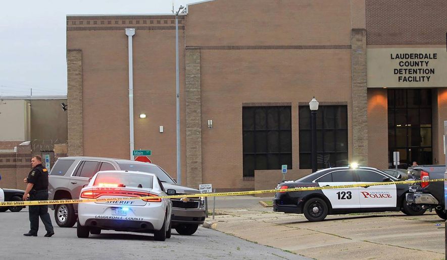 Police block off streets following the shooting of Lauderdale County Chancery Court Judge Charles Smith outside the Lauderdale County Courthouse, in Meridian, Miss., on Monday, March 16, 2020. Smith was shot and critically wounded in the parking lot outside the courthouse. (Dave Bohrer/The Meridian Star via AP)