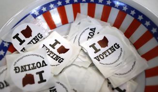 I voted stickers are seen at a polling place, Sunday, March 15, 2020, in Steubenville, Ohio. . (AP Photo/Gene J. Puskar)