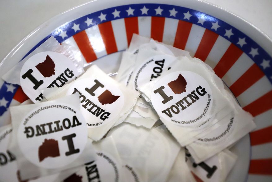 A bowl of stickers for those taking advantage of early voting in Steubenville, Ohio. (AP Photo/Gene J. Puskar, File)