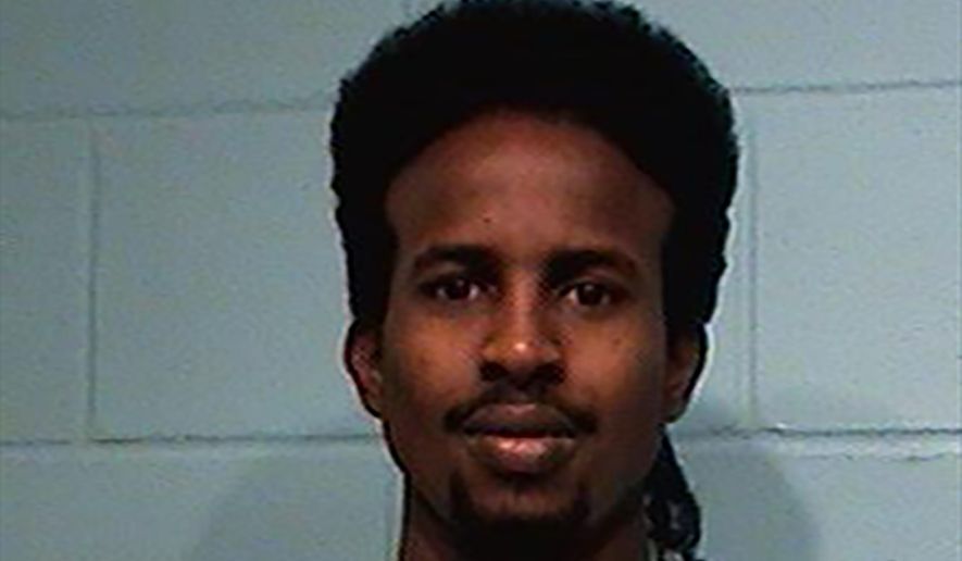 This 2014 photo provided by St. Croix County Sheriff's Department in in Hudson, Wis., shows Ahmed Farah Hirsi. Hirsi was charged with multiple counts of attempted homicide and reckless endangerment after he allegedly opened fire on a rival group of Somalis at a liquor store. A state appeals court granted him a new trial Monday March 16, 2020.(St. Croix County Sheriff's Department via AP)