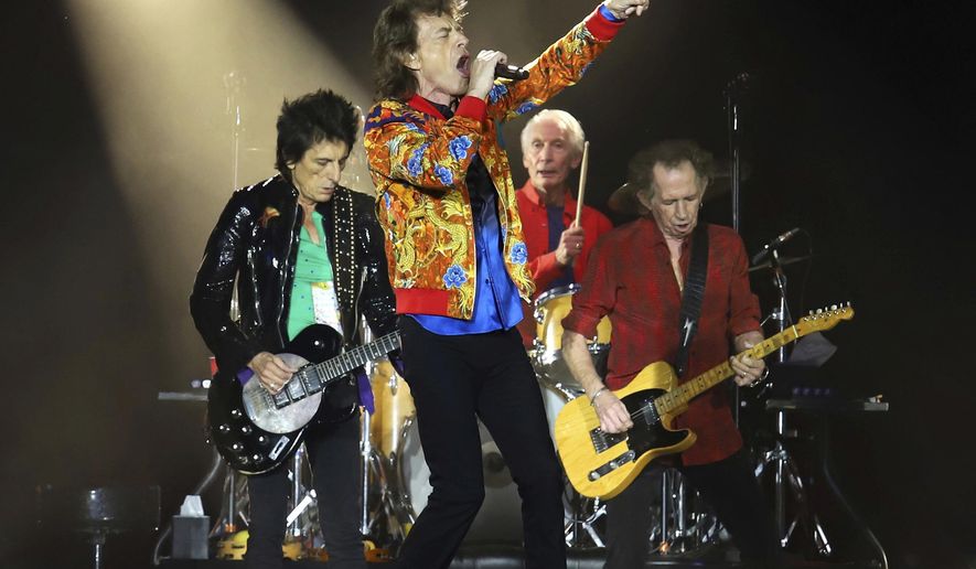 FILE - In this Aug. 5, 2019 file photo, Ronnie Wood, from left, Mick Jagger, Charlie Watts and Keith Richards of The Rolling Stones perform in East Rutherford, N.J. The Rolling Stones are postponing its 15-city North American tour because of the coronavirus. The band announced Tuesday that it's No Filter Tour, originally expected to kick off in San Diego on May 8, will no longer take place. (Photo by Greg Allen/Invision/AP, File)
