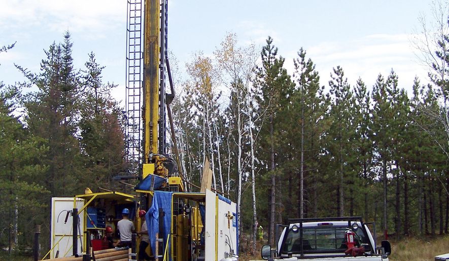 FILE - In this Oct. 4, 2011, file photo, a prospecting drill rig bores into the bedrock near Ely, Minn., in search of copper, nickel and precious metals that Twin Metals Minnesota LLC hopes to mine near the Boundary Waters Canoe Area Wilderness in northeastern Minnesota. A federal judge on Tuesday, March 17, 2020, rejected a challenge by environmental groups against the proposed Twin Metals copper-nickel mine in northeastern Minnesota, saying the Interior Department had the authority to reverse itself and renew the project's federal mineral rights leases. (AP Photo/Steve Karnowski, File)