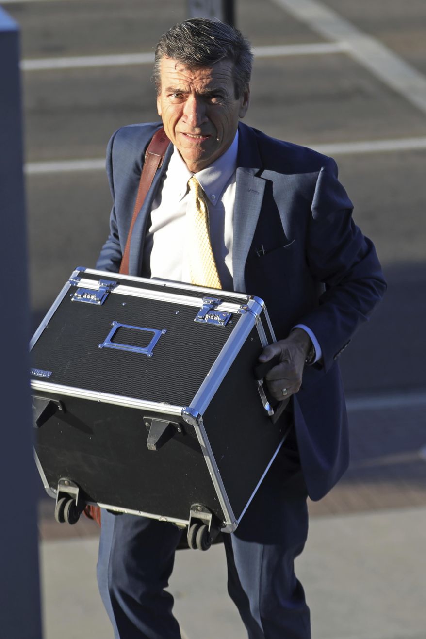 FILE - In this Aug. 23, 2019, file photo, defense attorney Greg Skordas arrives at federal courthouse, in Salt Lake City. New candidates are joining the race for Utah Attorney General, including a high-profile defense attorney and a reform-minded county prosecutor. Defense attorney and former prosecutor Skordas announced his candidacy Tuesday, March 17, 2020, days after Utah County Attorney David O. Leavitt said he would challenge Republican Sean Reyes for the job. (AP Photo/Rick Bowmer, File)