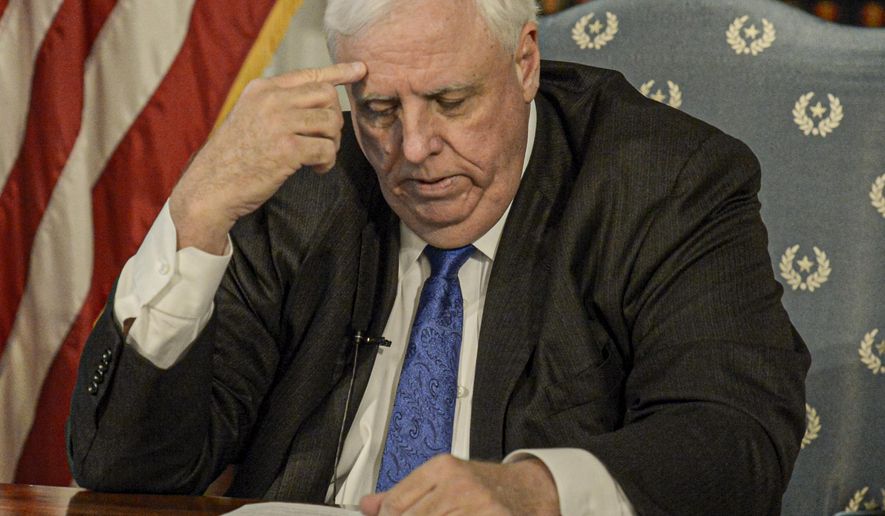 West Virginia Gov. Jim Justice speaks during a news conference at the State Capitol in Charleston, W.Va., Monday March 16, 2020. Justice declared a state of emergency in response to the new coronavirus, even as West Virginia remains the last state in the U.S. without a confirmed case. (F. Brian Ferguson/Charleston Gazette-Mail via AP)