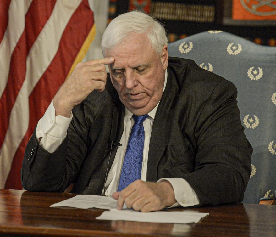West Virginia Gov. Jim Justice speaks during a news conference at the State Capitol in Charleston, W.Va., Monday March 16, 2020. Justice declared a state of emergency in response to the new coronavirus, even as West Virginia remains the last state in the U.S. without a confirmed case. (F. Brian Ferguson/Charleston Gazette-Mail via AP)
