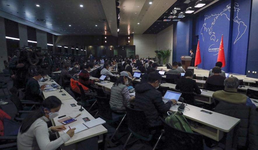 Chinese Foreign Ministry spokesman Geng Shuang speaks during a daily briefing at the Ministry of Foreign Affairs office in Beijing, Wednesday, March 18, 2020. At least 13 American journalists stand to be expelled from China in retaliation for a new limit imposed by the Trump administration on visas for Chinese state-owned media operating in the U.S. (AP Photo/Andy Wong)